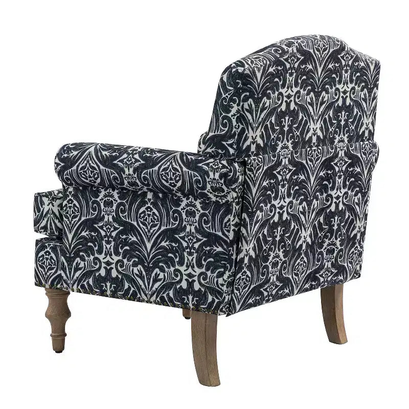 Fauteuil rembourré en bois avec motif floral, accoudoirs à panneaux et dossier en forme de bosse de chameau.